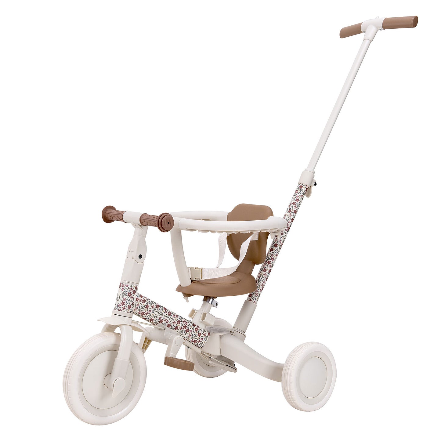 ALT : Tricycle Little Dutch fleuri utilisé en extérieur, idéal pour les promenades avec bébé.