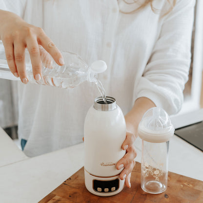 Chauffe-biberon Nomade Easy Heat charge USB-C et chargeur DC fourni.