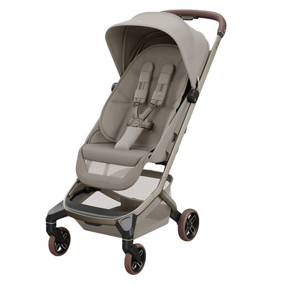 Poussette Maxi-Cosi Fame Cabin Sapphire Sand ultra compacte et premium conçue pour les voyages et déplacements avec bébé dès la naissance