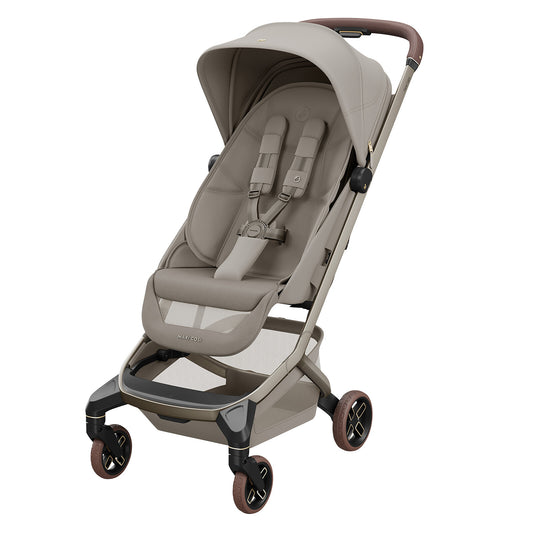 Poussette Maxi-Cosi Fame Cabin Sapphire Sand ultra compacte et premium conçue pour les voyages et déplacements avec bébé dès la naissance