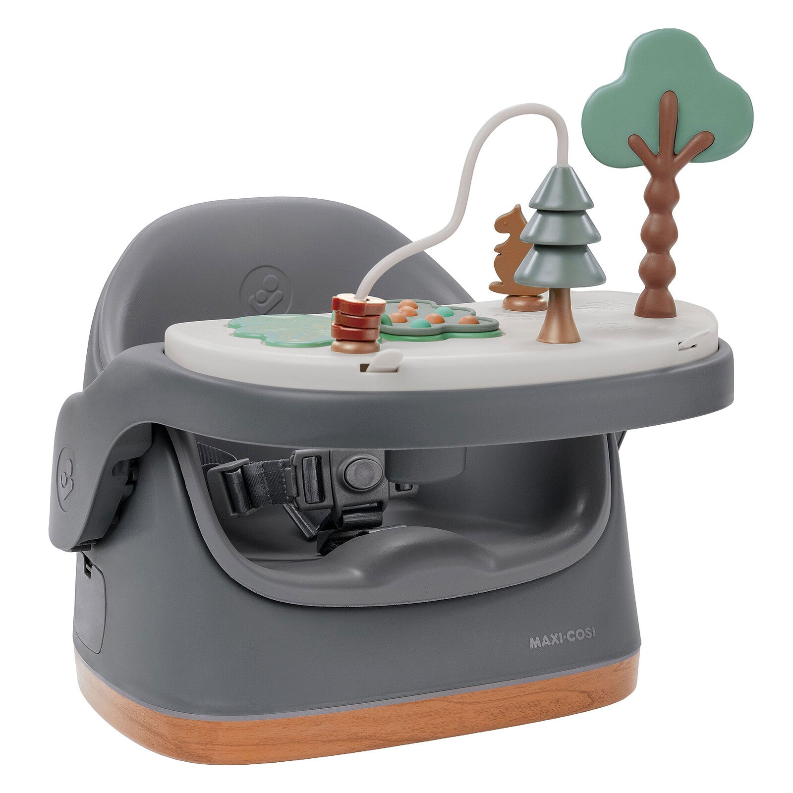 Rehausseur de chaise Maxi-Cosi Jay Plus gris posé sur une table, pratique pour les repas de bébé.