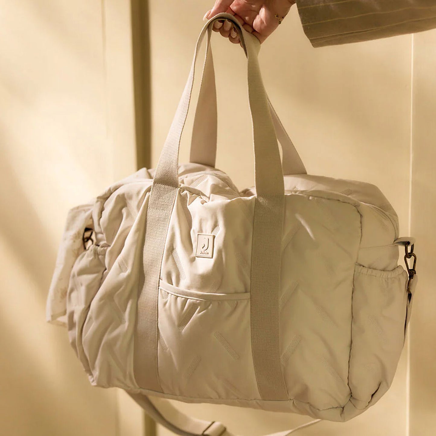 Intérieur du sac à langer Jollein Embossed Lily Sand avec poches