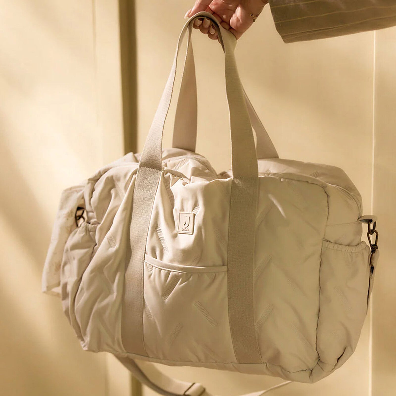 Intérieur du sac à langer Jollein Embossed Lily Sand avec poches