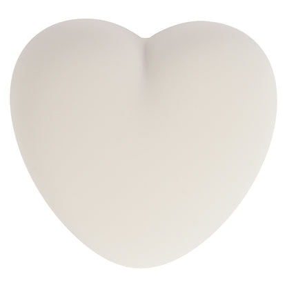 Veilleuse d’allaitement Flow gris posée sur une table de nuit